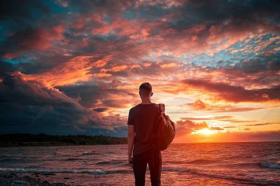 pngtree-man-looks-at-sunset-by-the-sea-photo-image_2370149.jpg